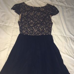 Navy blue dress with lace detailing on bust